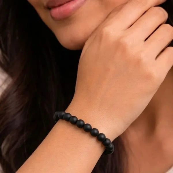 Karungali Bracelet in female hand.webp