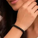 Karungali Bracelet in female hand.webp