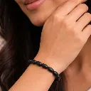 Karungali Bracelet in female hand.webp