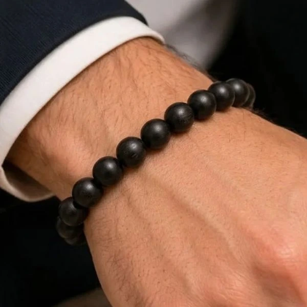 Karungali Bracelet in male hand.webp